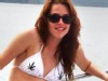 PHOTO Twilight actress Kristen Stewart is pictured in a bikini adorned with marijuana leaves while she relaxes with a male friend in Costa Rica