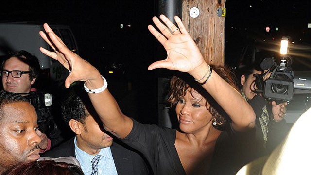 PHOTO: Whitney Houston waves to the crowd looking worse for wear last night in Hollywood, California after enjoying a party with friends, Feb. 9, 2012.