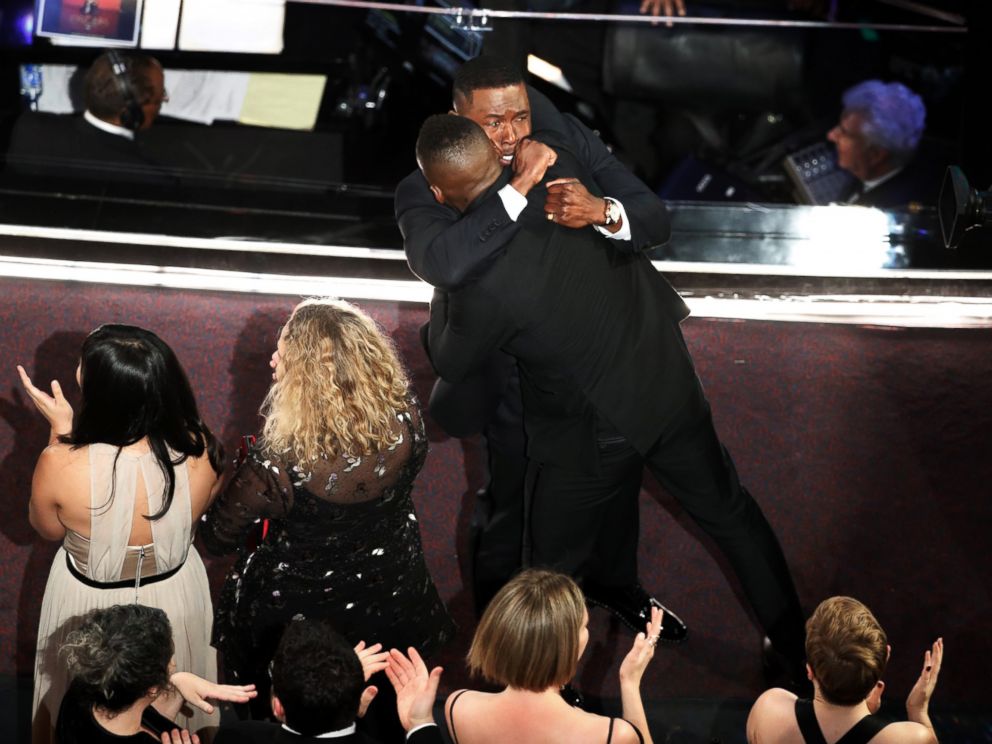 PHOTO: Moonlight castmembers Mahershala Ali and Trevante Rhodes hug after it was announced that the movie won Best Picture during the telecast of the 89th Academy Awards on Feb. 26, 2017 in Hollywood, Calif.