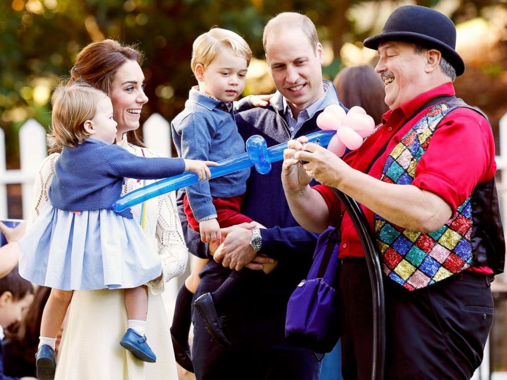 PHOTO: Britains Princess Charlotte, Catherine, Duchess of Cambridge, Prince George and Prince William, watch as a man inflates balloons at a childrens party at Government House in Victoria, British Columbia, Canada, Sept. 29, 2016.