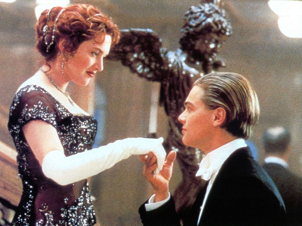 PHOTO: Kate Winslet offers her hand to Leonardo DiCaprio in a scene from the film Titanic, 1997.