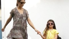 Katie Comforts Suri