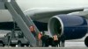 VIDEO: Nigerian passenger allegedly attempted to ignite explosives taped to legs.