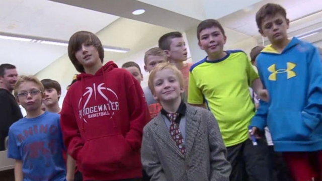 VIDEO: Football team at elementary school stand up for waterboy picked on for speech disorder.