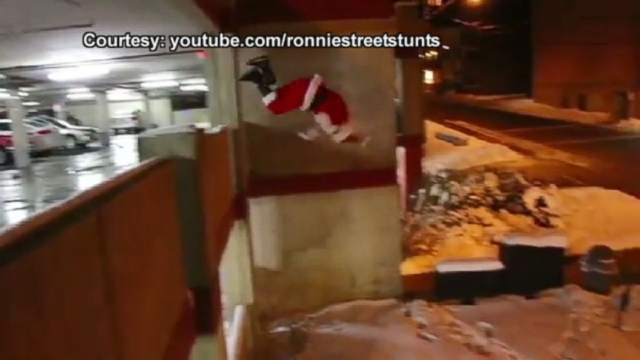 Stuntman Ronnie Shalvis dresses as Santa for extreme gift-delivering.