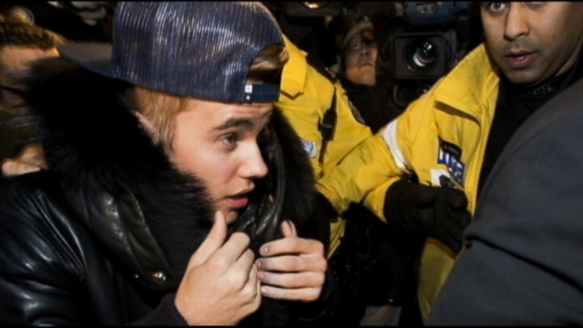 VIDEO: The superstar returned to his home country to answer assault charges in Toronto.