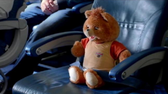 VIDEO: Hair scrunchies, leg warmers and Teddy Ruxpin are all part of this in-flight video.
