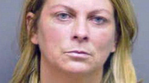 PHOTO April Newcomb, shown in this booking photo, has been charged with child abuse after encouraging her teenager daughter to fight.