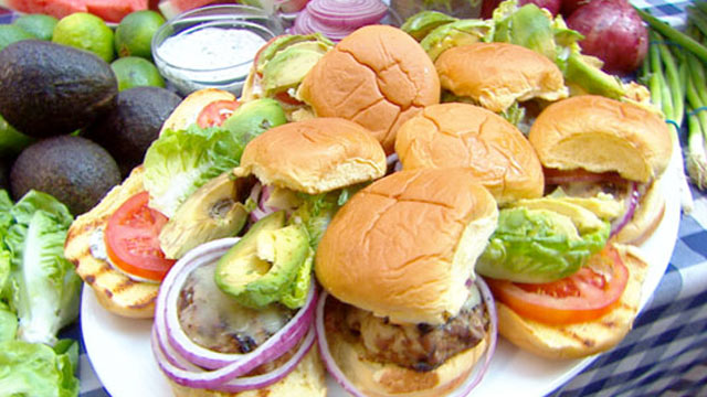 PHOTO: Emeril prepares turkey burgers with cilantro mayonnaise for "Good Morning America."