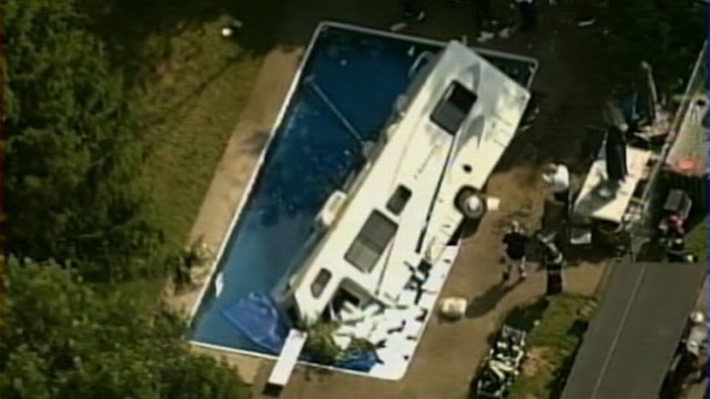 VIDEO: A 30-foot RV crashed through fence into swimming pool after pedal got stuck.