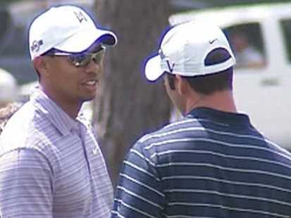 VIDEO: Uniformed and plainclothes security guards surround Tiger Woods at Augusta.