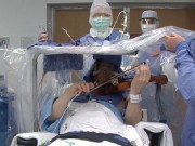 Violinist Plays as Surgeons Operate