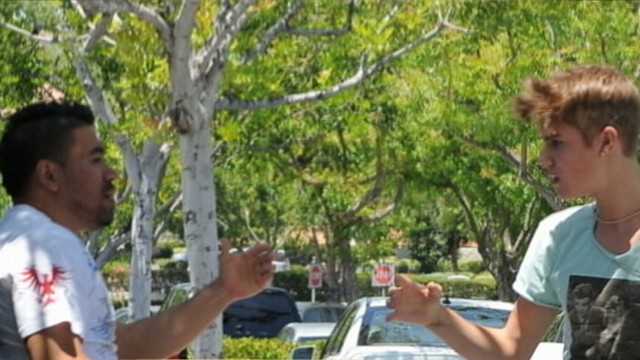 VIDEO: Police want answers about singers quarrel with a photographer in his way.