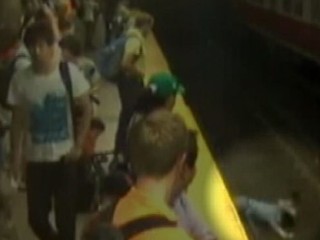 Watch: Bystanders Pull Mom, Son From Subway Tracks