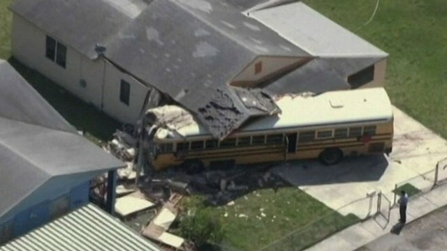 VIDEO: School bus in Miami, Fla., careens into house after colliding with an SUV.