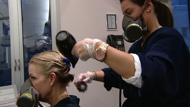 VIDEO: The questionable safety of the hair process prompted one salon to use gas masks.