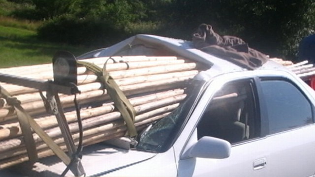 VIDEO: A truck stopped short and sent the poles it was hauling through the car behind it.