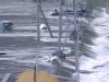 VIDEO: Surging waters sweep vehicles under a road bridge in Miyagi Prefecture, Japan.