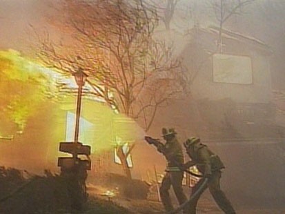 A picture of fire fighers fighting fire.