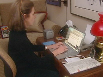 VIDEO: A woman typing at a desk.