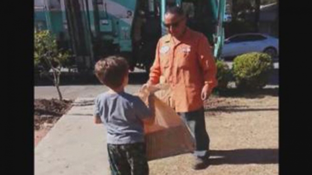 VIDEO: Garbage Collector Delivers Special Toy