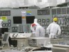 Workers in crippled nuclear power plant scramble to pump out radioactive water.