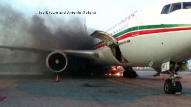 VIDEO: A baggage truck caught fire on a Montreal runway causing a jet to fill with smoke.