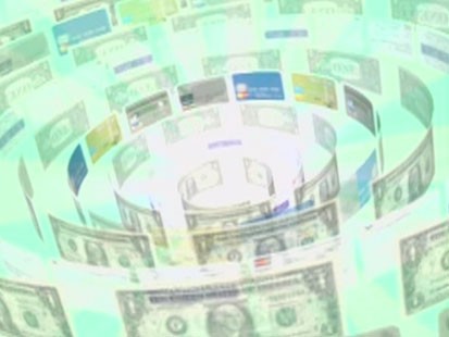 An image of swirling credit cards and dollars.