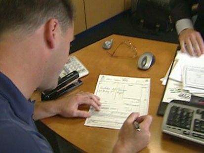 Man signing a lease