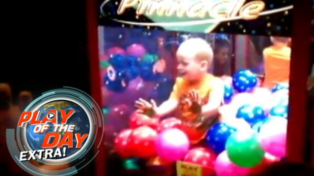 VIDEO: A curious toddler climbed his way into the claw game at a local bowling alley.