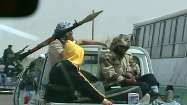 VIDEO: Footage shows rebels fleeing after ambush by Gadhafi forces.