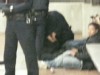 VIDEO: Police officers and several men handcuffed on the ground.