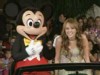 A picture of Miley Cyrus and Mickey Mouse.