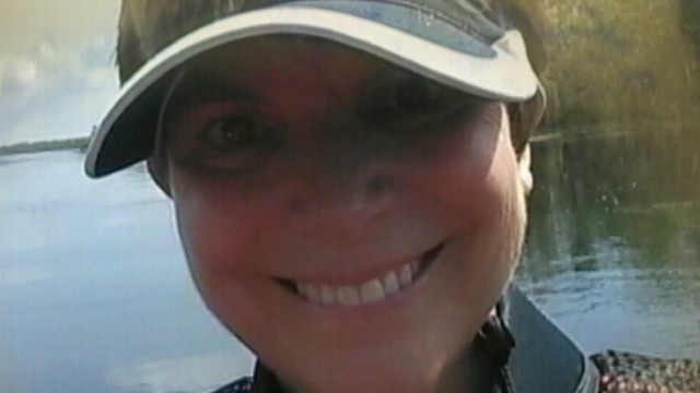 VIDEO: Sarah Boytons inflatable kayak started sinking after a large alligator latched onto it.