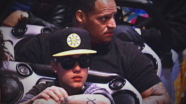 VIDEO: Photographer says one of the pop stars bodyguards choked him.