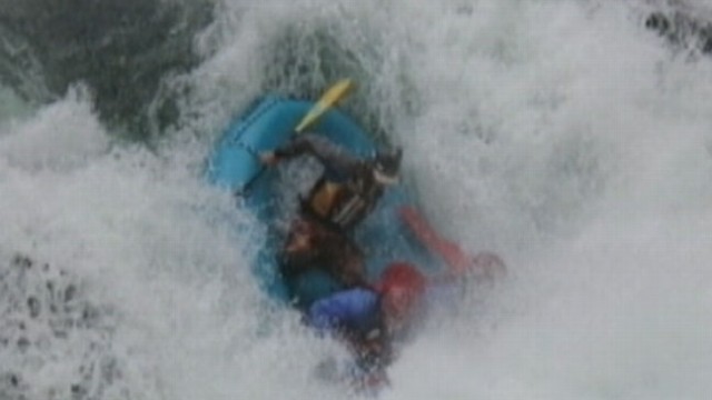 VIDEO: White water rafting guide jumped into action after one of his rafters went overboard.