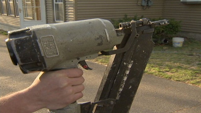 VIDEO: Builder Dennis Hennis shot himself with a nail while on the job.