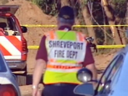 VIDEO: The victims were wading in shallow water when they stepped into a sinkhole.