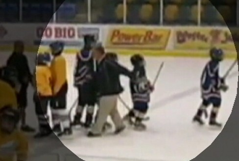 VIDEO: A hockey coach was caught on tape tripping an opposing team?s player, breaking his wrist.