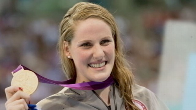 VIDEO: The 17-year-old swimmer dedicated her gold medal win to the shooting victims in her home town.
