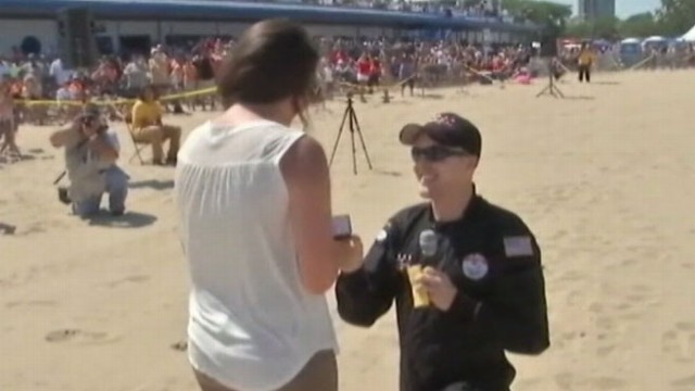 VIDEO: Dan Cook popped the question to his girlfriend Leah upon landing.