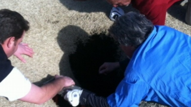 VIDEO: Illinois Golfer Mark Mihal was saved by his friends on the course after a scary drop.
