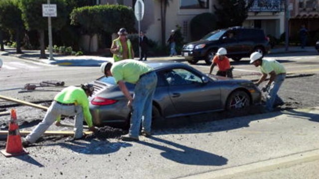 VIDEO: Driver trying to speed past a construction zone ends up stuck in wet cement.