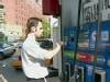 A picture of a man paying for gas.