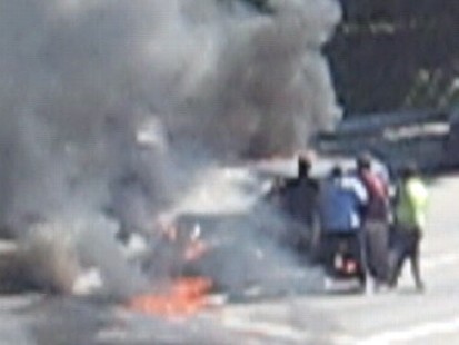 VIDEO: A small army of helpers pulled Robert Edlefson from his burning 1932 Ford.