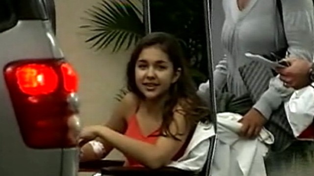 VIDEO: Woman wrestles teen out of the mouth of a shark.