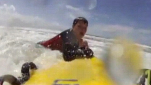 VIDEO: Lifeguards dramatic rescue of British boy is captured by surfboard camera.