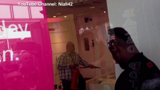 VIDEO: London customer rips displays off wall, sprays fire extinguisher inside store.