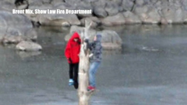 VIDEO:Two Arizona teenagers are rescued by firefighters as ice cracks beneath them.