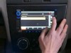 VIDEO: A hand touching a car's computer monitor.